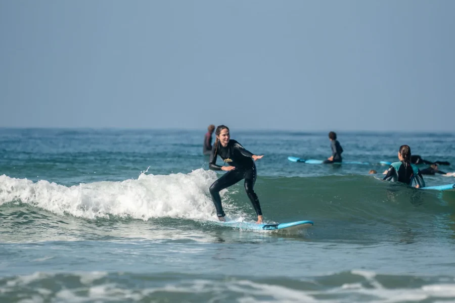 Blue Mind Morocco surfer catching wave in Tamraght