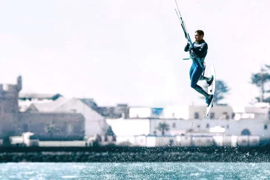 Kitesurfer riding with Essaouira fortress in the background